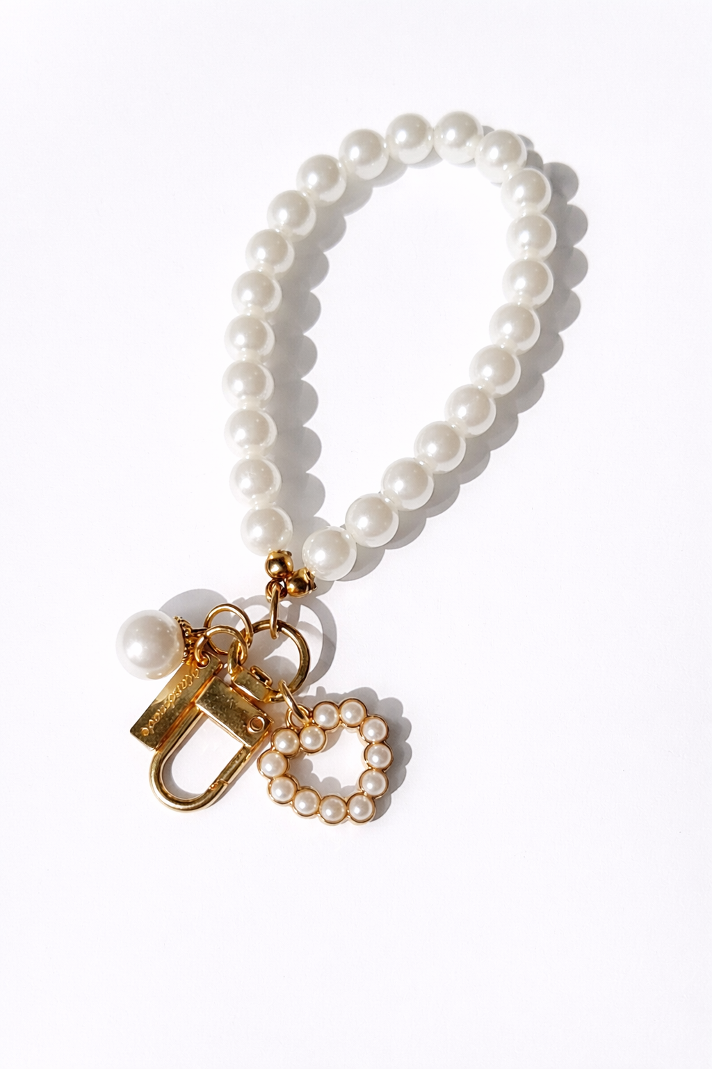 Pearl heart keychain with gold-toned hardware by Anya June