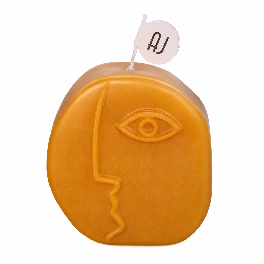 Pure beeswax sculptural face candle with honey and chocolate fudge scent by Anya June